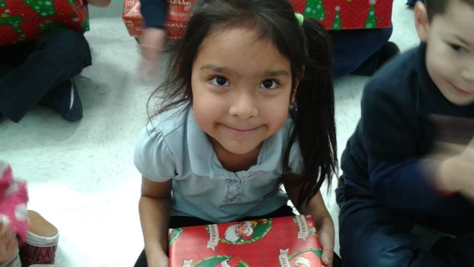 Child at Guadalupe School with New Shoes from Utah First and The Community Volunteers of Utah Warm the Soles
