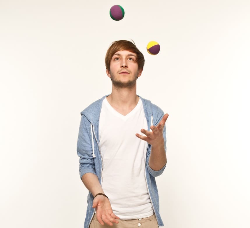 Man Juggling to Illustrate the Challenge of Multiple Credit Cards - Balance Transfer Can Simplify