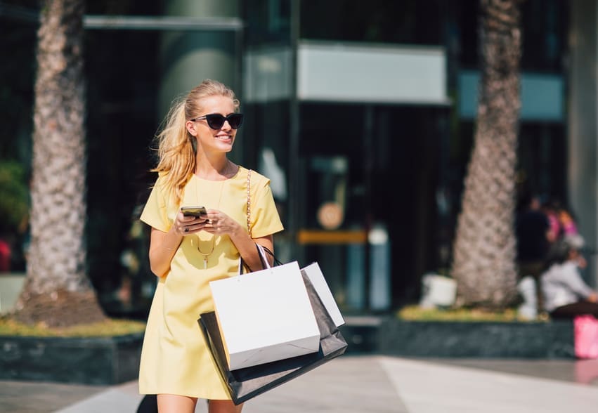 Woman Shopping Using Mobile Wallet